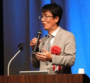 DXセレクション2026最終選考で旭光電機株式会社代表取締役社長が製造業DXの取り組みを発表している様子-2